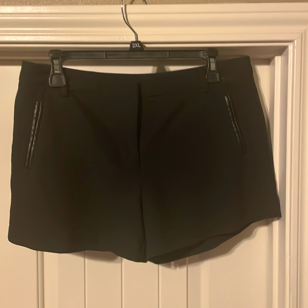 Black shorts with leather pocket details